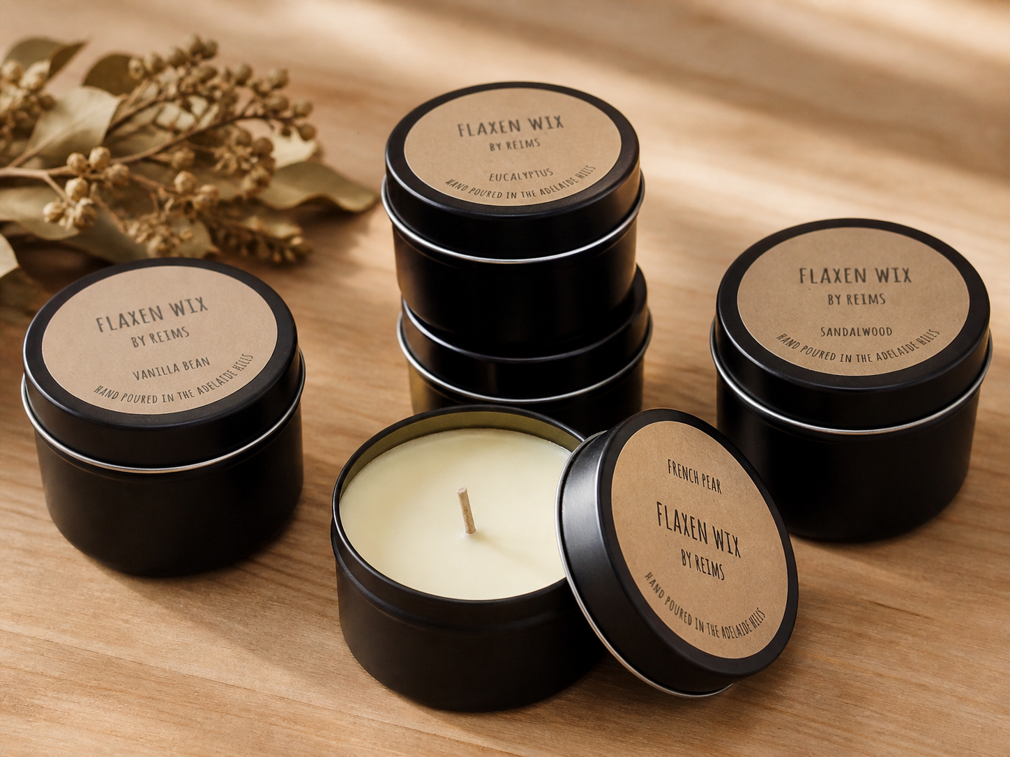 A group of Flaxen Wix candle tins